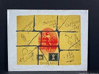 Full view of the signed and numbered art print titled "Beautiful Boy" featuring a red figure surrounded by divided panels with handwritten text and drawings on a mustard yellow background.