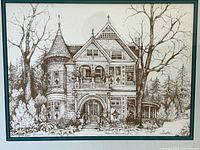 Close-up of print displaying detailed Victorian home drawing in black and white with artist signature.