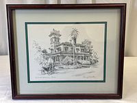 Framed signed black and white print of Bidwell Mansion showing full frame and matting.