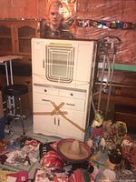 Front view of entire cabinet showing glass panel, drawers and doors