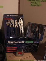 All tool sets and measuring tape together in original packaging.