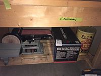 Photo of King Canada 6 inch bench grinder box and Delta sander on wooden shelf.
