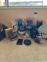 Lot with all smaller items including boxed Furby, President Bush doll, model Porsche kit, and assorted vases and collectibles.