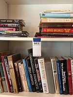 Five shelves of various books including authors and subjects such as crime fiction, history and encyclopedias.