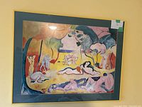 Framed colorful print titled "The Joy of Life" featuring abstract nude figures in a landscape.