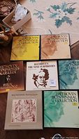 Seven Beethoven vinyl record albums laid out on a rug including multiple volumes of the Beethoven Bicentennial Collection and other collections.