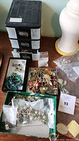 Overview of plastic drawer organizer, jewelry trays, Ziploc bag and assorted pieces