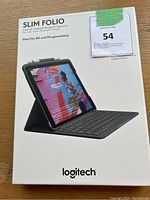 Front of the box showing Logitech Slim Folio case with integrated Bluetooth keyboard compatible with iPad 7th, 8th, and 9th generation