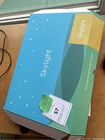 Closed box with Skylight branding and stars design showing the product packaging.