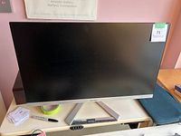 Front view of the ViewSonic monitor showing black screen and slim bezel with silver trim on V-shaped stand.