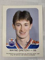 Front image of Wayne Gretzky hockey card featuring player photo, Edmonton Oilers logo, and autograph.