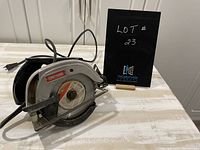 Side view of Sears Craftsman 7 1/4 inch circular saw showing blade, guard, handle, and power cord.