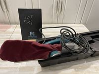 Full view of sander in case with dust bag attached