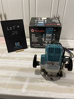 Router and original Makita box displayed on work surface