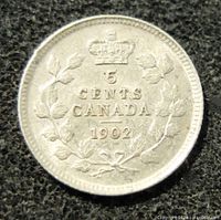 Reverse side of the 1902 Canadian 5 cents sterling silver coin featuring crown, wreath, denomination and date 1902.