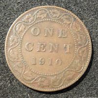 Reverse side of the 1910 Canada one cent coin showing 'ONE CENT 1910' with a decorative border of maple leaves.