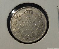 Reverse of the coin showing denomination, country, and date inside a crowned wreath.