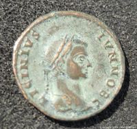 Front side of ancient Roman coin showing portrait of Emperor Constantine with laurel wreath and inscriptions.