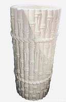 White ceramic umbrella holder or vase with faux bamboo design, vertical view showing textured bamboo stalk pattern with horizontal bands around the circumference.