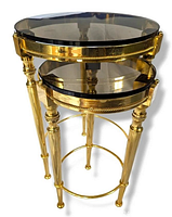 Stacked nested tables, two brass frame tables with round smoke glass tops