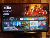 Front display of Samsung 28-inch Smart TV showing streaming home screen interface.