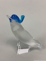 Crystal Blue Jay figurine with blue head and tail accents, clear faceted base, shown from side angle