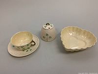 Overall lot with teacup, saucer, lidded marmalade jar, and heart-shaped dish visible