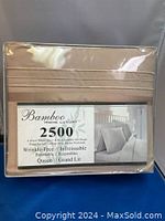 Front packaging of Bamboo Home Luxury 4-piece queen size sheet set showing 2500 thread count, wrinkle-free, breathable microfiber fabric label in light brown color.
