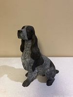 Front view of dog door stop showing detailed face and fur texture.