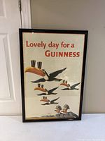 Full view of framed poster showing text, illustrations and frame