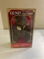 Front view of GUND 1990 Collector's Bear in box, showing bear inside and branding on the box