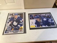 Two photos of the Toronto Maple Leafs players Auston Matthews and Mitch Marner side by side, sealed in plastic wrapping.