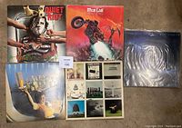 All five records laid flat showing front covers including Quiet Riot, Meat Loaf, Dire Straits (shrink wrapped), Supertramp, and Pink Floyd albums.