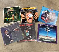 Photo showing all six vinyl records with visible album art and titles.