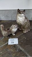 Two Beswick England figurines, one cat and one dog, showing size and coloration