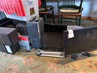 Vizio TV, speakers, boxes, and tripod on carpet