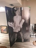 Front view of the three-panel Marilyn Monroe room divider standing upright in room.