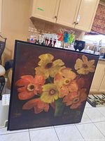 Full front view of framed canvas print showing flower bouquet artwork and frame condition