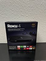 Front of the Roku 4K Ultra HD box showing the product and features.