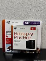 Front of sealed retail box showing Seagate Backup Plus Hub branding, 6TB capacity, USB 3.0 interface and Rescue Service bundle.
