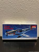 Front view of sealed box showing detailed artwork of P-51D Mustang with branding and model name