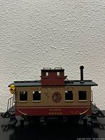 Side view of the Aristo-Craft Napa Valley Wine Bobber Caboose showing detailed exterior and markings.