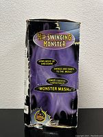 Original product box with Halloween Factory branding, purple and black, showing features of the Hip Swinging Monster Frankenstein figure, including arm movement and musical 'Monster Mash' song.