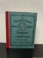 Front cover of vintage International Postage Stamp Album Junior Edition by Scott Stamp & Coin Co.