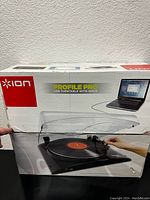Box of new Ion Profile Pro USB turntable with input, showing the product image and laptop connection on packaging.