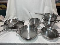 Wide view of entire cookware assortment on white backdrop