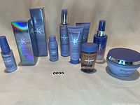 Full view of all 9 Kerastase Blond Absolu products including boxed and unboxed bottles, tubes and jars.