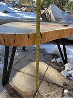 Table height measurement approximately 18 inches with tape measure from ground to tabletop