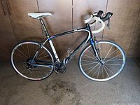 Full left-side view showing frame, wheels, saddle