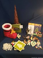 Full lot arranged on dark blue background showing all ornaments, plates, stocking, cards, and other decorations